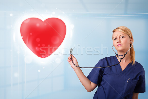 Foto stock: Jóvenes · enfermera · curación · rojo · corazón · bastante