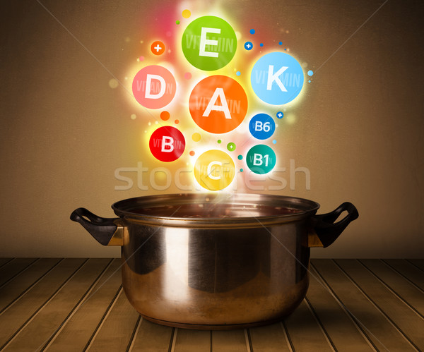 Colorful vitamins coming out from cooking pot Stock photo © ra2studio