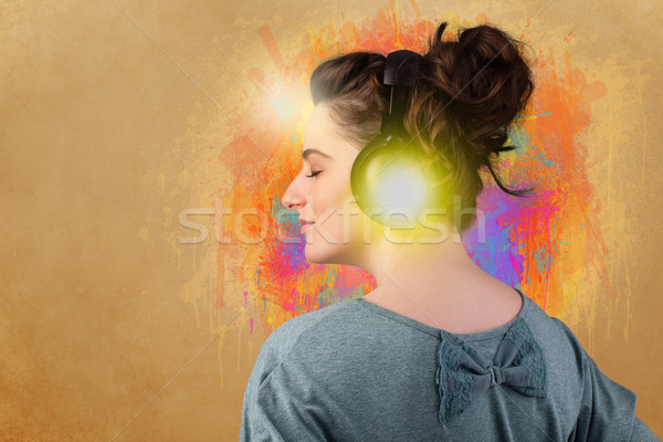 Young woman with headphones listening to music Stock photo © ra2studio