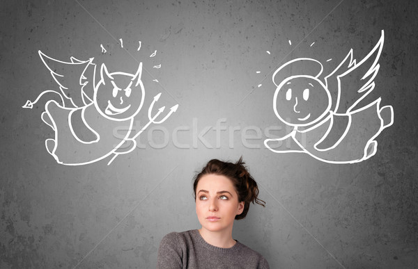 Woman standing between the angel and the devil Stock photo © ra2studio