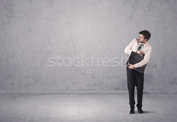 Jungen Geschäftsmann stehen verwechselt überrascht Umsatz Stock foto © ra2studio