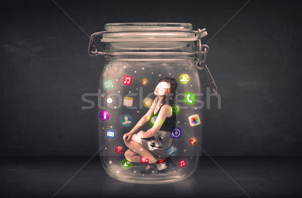 Businesswoman captured in a glass jar with colourful app icons c Stock photo © ra2studio