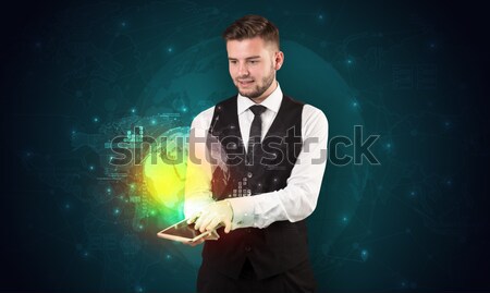 Businessman holding a white cup with diagrams and graphs Stock photo © ra2studio