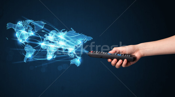 Hand with remote control, social media concept Stock photo © ra2studio