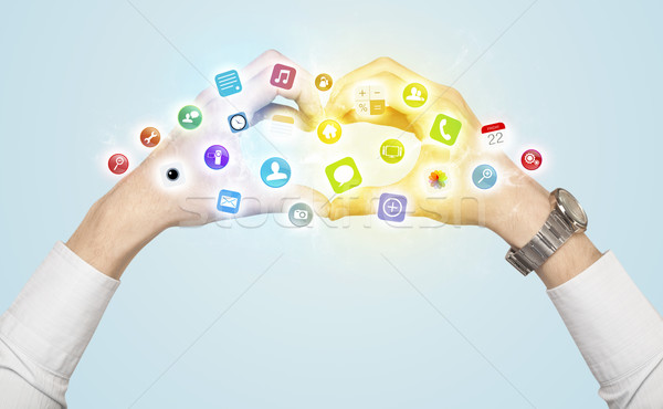 Hands creating a form with mobile app icons Stock photo © ra2studio