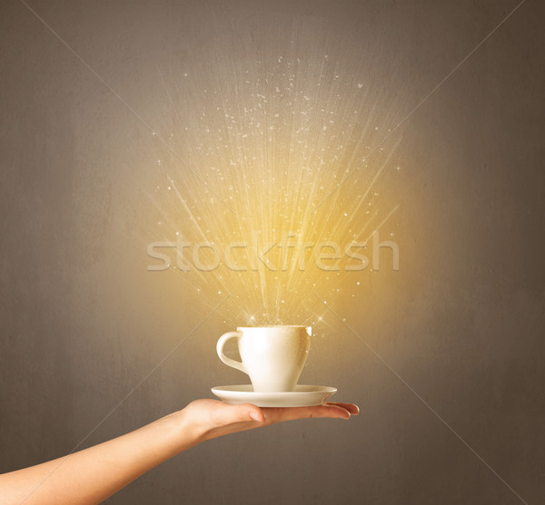 Female hand holding coffee cup Stock photo © ra2studio