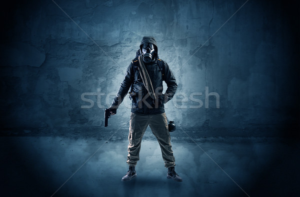 Peril man in front of a crumbly wall Stock photo © ra2studio