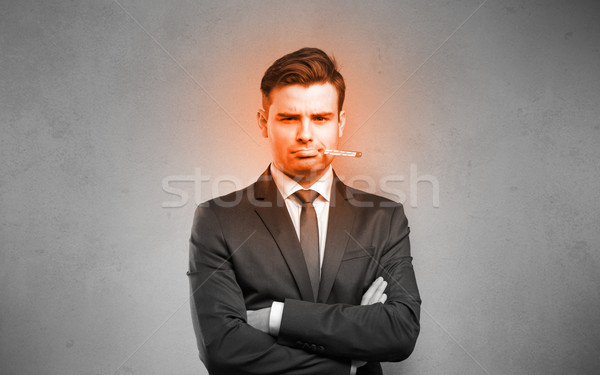 Sick businessman with burning red head concept Stock photo © ra2studio