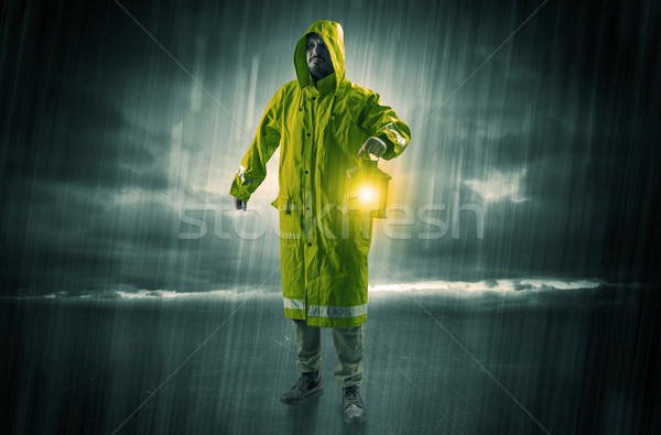 Man walking in storm with lantern Stock photo © ra2studio