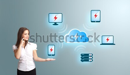 Stock photo: Beautiful young woman making phone call and presenting cloud computing network