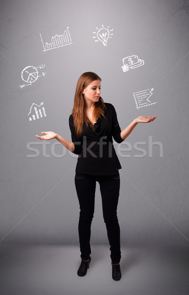 beautiful young woman juggling with statistics and graphs Stock photo © ra2studio