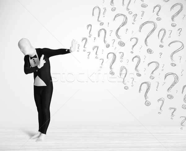 3d human character is body suit morphsuit looking at hand drawn question marks Stock photo © ra2studio