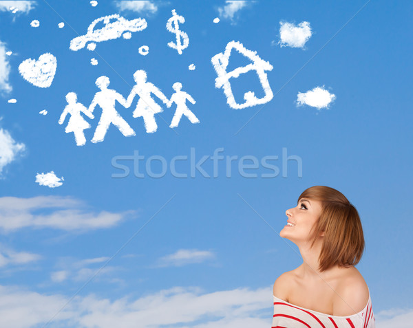 Young girl daydreaming with family and household clouds  Stock photo © ra2studio