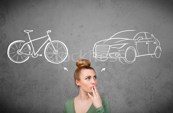 Woman making a choice between bicycle and car Stock photo © ra2studio