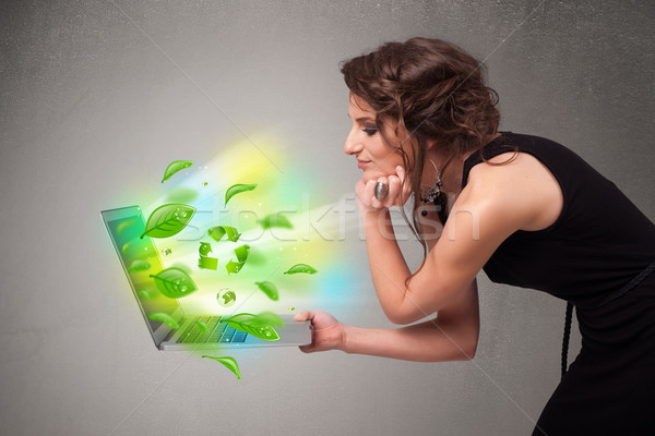 Casual woman holding notebook with recycle and environmental sym Stock photo © ra2studio