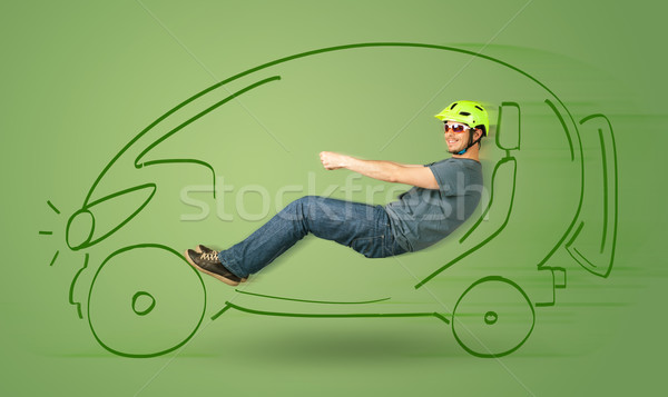 Man drives an eco friendy electric hand drawn car  Stock photo © ra2studio