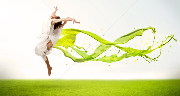 Joli fille sautant vert résumé liquide Photo stock © ra2studio