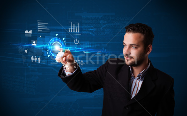 Handsome businessman touching future web technology buttons and  Stock photo © ra2studio