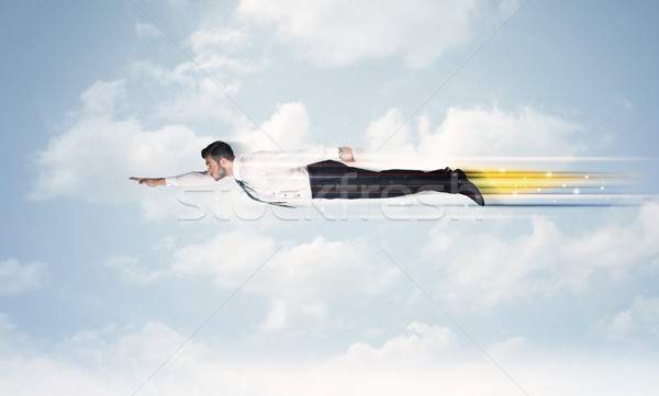 Boldog üzletember repülés gyors égbolt felhők Stock fotó © ra2studio