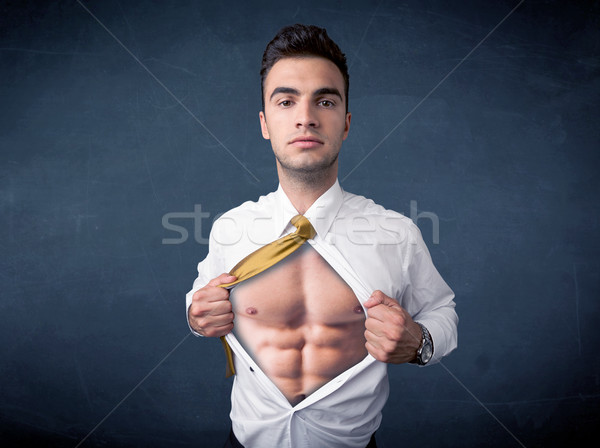 Businessman tearing off shirt and showing mucular body Stock photo © ra2studio