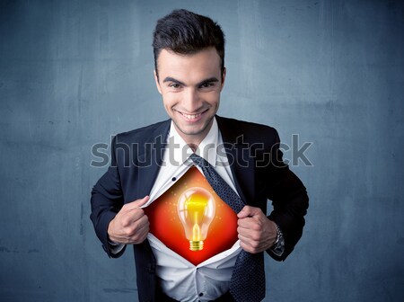 Businessman ripping off shirt and idea light bulb appears  Stock photo © ra2studio