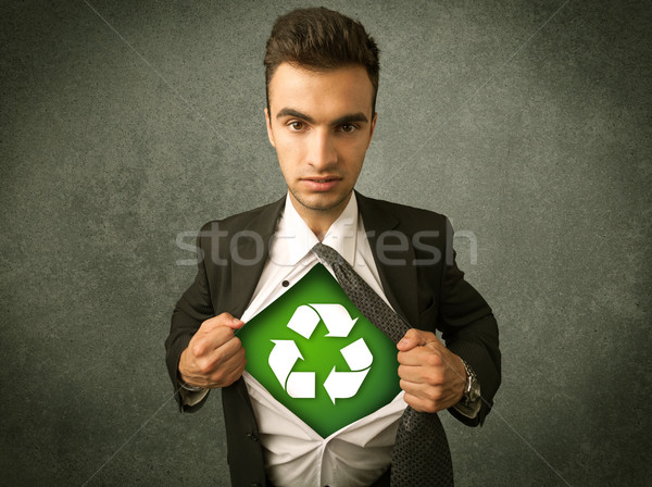 Enviromentalist business man tearing off shirt with recycle sign Stock photo © ra2studio