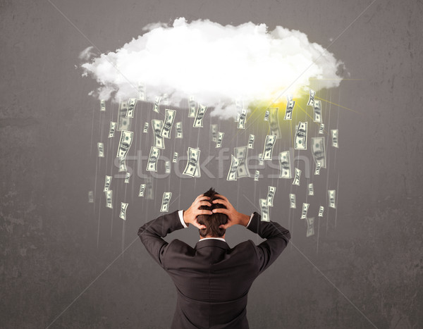 Business man in suit looking at cloud with falling money Stock photo © ra2studio