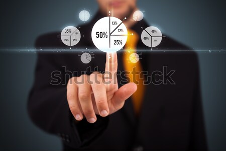 Stock photo: Tech business person touching button with orange light beams con