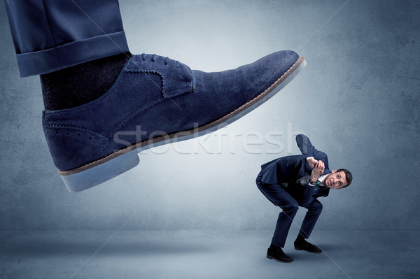 Cruel boss tramping his employee Stock photo © ra2studio