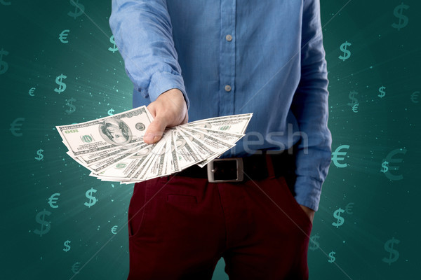 Businessman holding money Stock photo © ra2studio