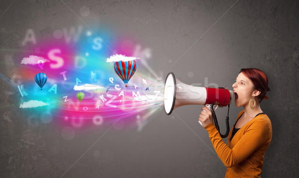 Stock photo: Cute girl shouting into megaphone and abstract text and balloons come out