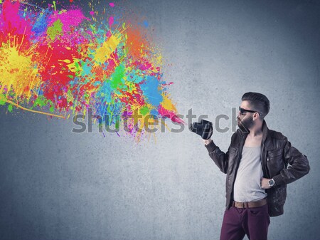 Worker with airbrush and colorful abstract clouds and balloons Stock photo © ra2studio