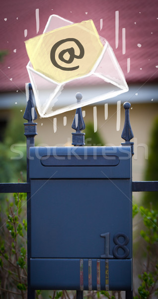 Envelope with email sign dropping into mailbox Stock photo © ra2studio