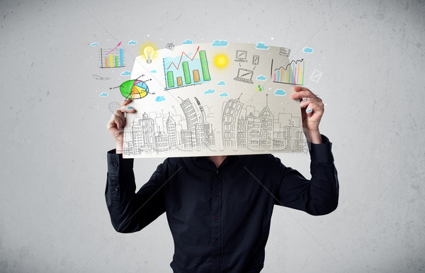 Businessman holding a paper with charts and cityscape in front o Stock photo © ra2studio