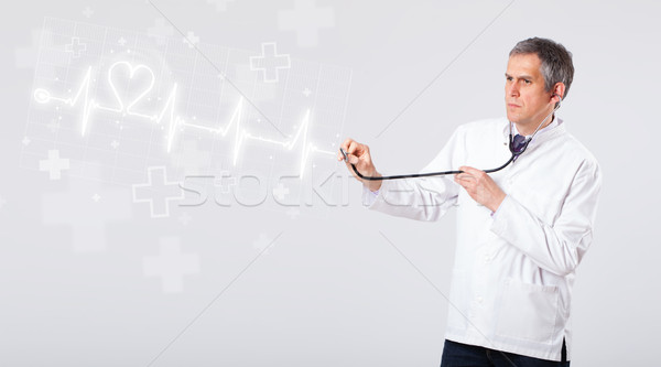 Doctor examinates heartbeat with abstract heart Stock photo © ra2studio