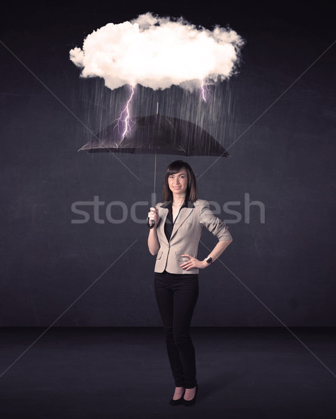 Femme d'affaires permanent parapluie peu tempête nuage [[stock_photo]] © ra2studio