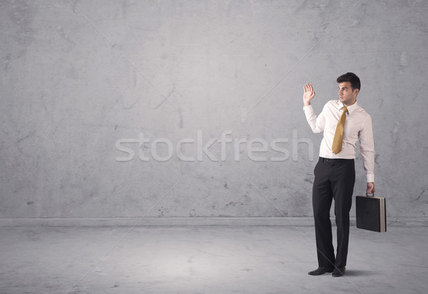 Stock photo: Young businessman standing confused