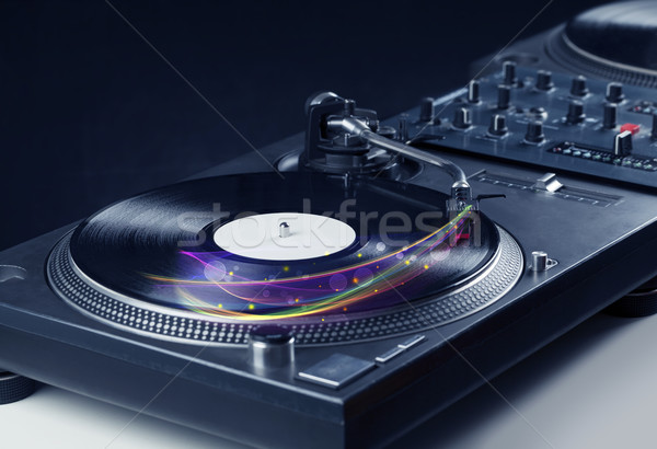 Turntable playing vinyl with glowing abstract lines Stock photo © ra2studio