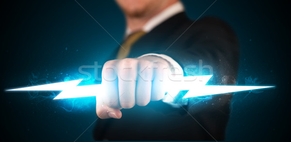 Geschäftsmann halten glühend Blitz Hände Feuer Stock foto © ra2studio
