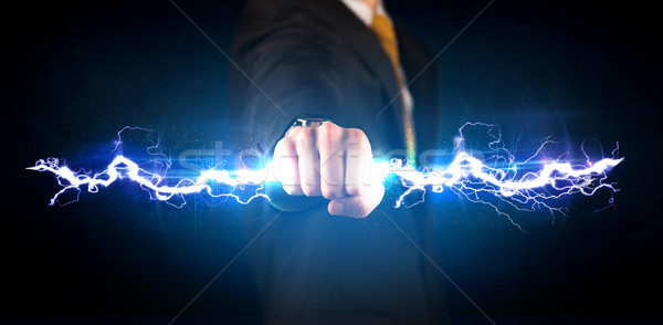 Zakenman elektriciteit licht bout handen Stockfoto © ra2studio