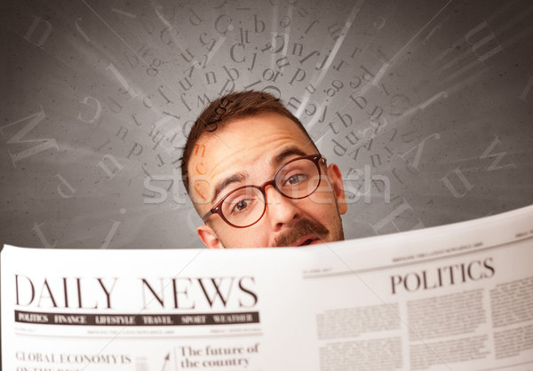 Businessman reading newspaper Stock photo © ra2studio