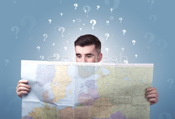 Young man holding map Stock photo © ra2studio