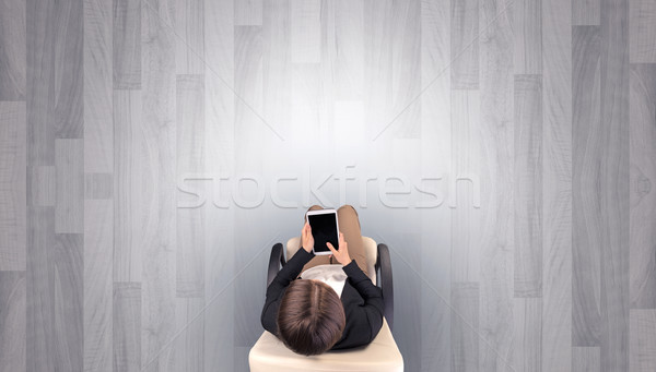 Woman sitting in chair in an empty office Stock photo © ra2studio