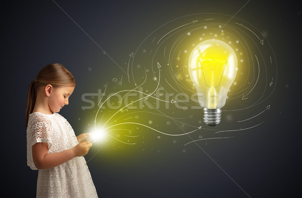 Girl holding tablet with new idea concept Stock photo © ra2studio
