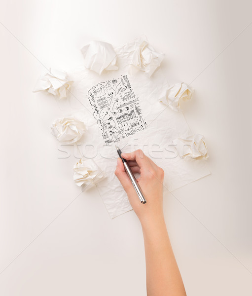 Stock photo: Writing hand in crumpled paper