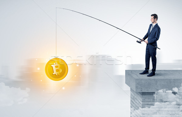 Businessman fishing coins concept Stock photo © ra2studio