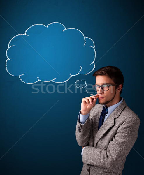 Stock photo: Young man smoking cigarette with idea cloud