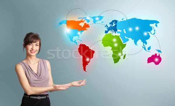 Young woman presenting colorful world map Stock photo © ra2studio