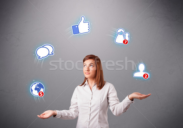 attractive young woman juggling with social network icons Stock photo © ra2studio