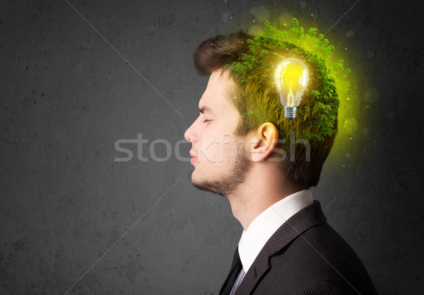 Young mind thinking of green eco energy with lightbulb Stock photo © ra2studio